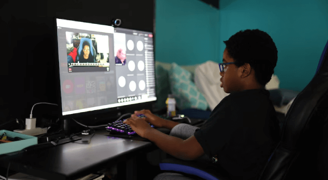 A boy studying from an elearning video