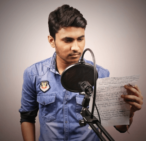A voice over artist holding the script to work on