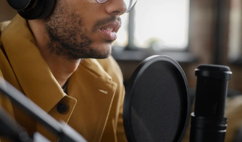 A Professional Voice Artist Recording His Voice in a Studio