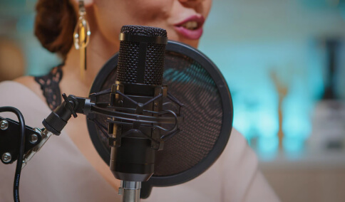 A voice artist recording in the studio